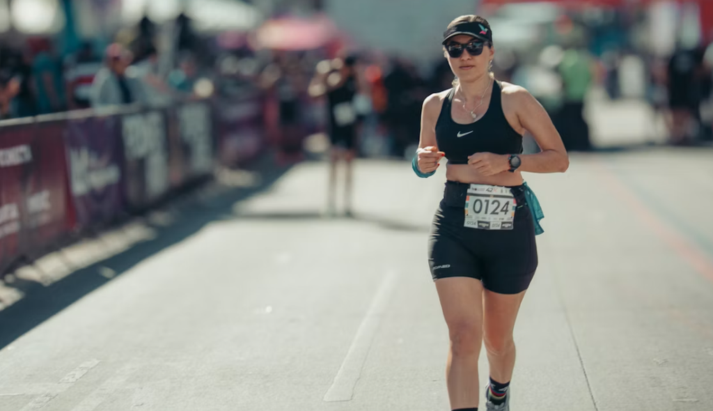 Athlete racing with custom bib